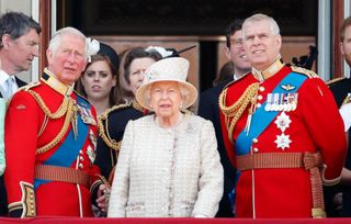 Prince Charles, Prince of Wales, Queen Elizabeth II and Prince Andrew, Duke of York watch a flypast from the balcony of Buckingham Palace during Trooping The Colour