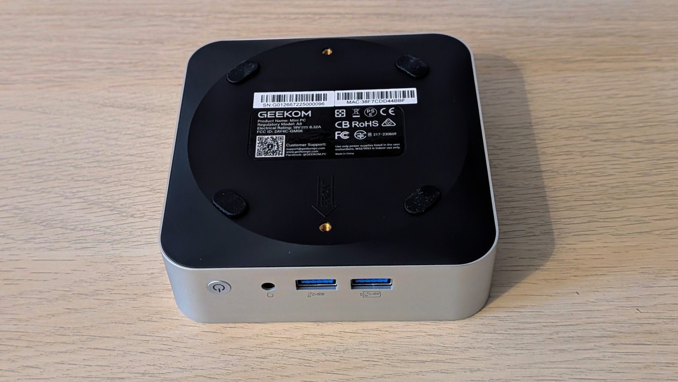 The Geekom A8 AI mini PC on a desk