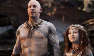 Ark 2 - Vin Diesel stands next to a woman in front of rocks