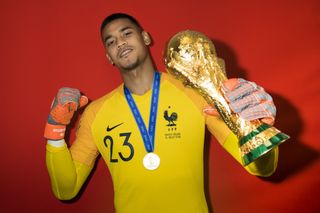 Alphonse Areola poses with the World Cup trophy after France's win over Croatia in Moscow in July 2018.