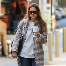 Katie Holmes grabs coffee with a friend in New York wearing a plaid coat and sweatshirt