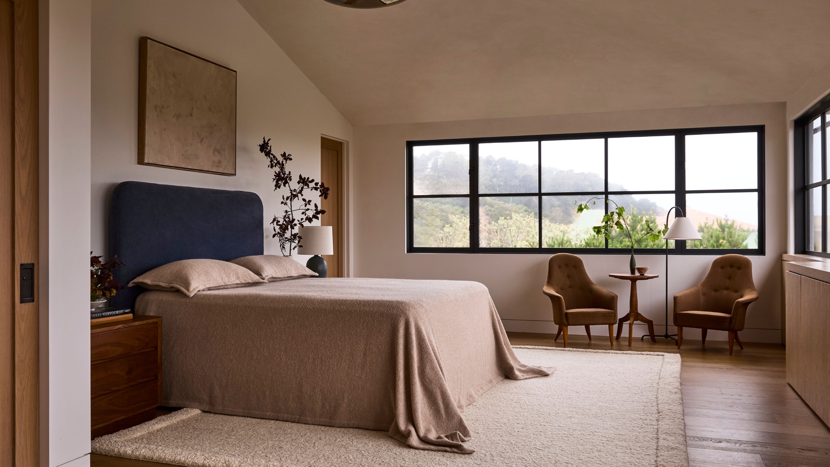 a neutral wabi sabi bedroom with views across San Francisco
