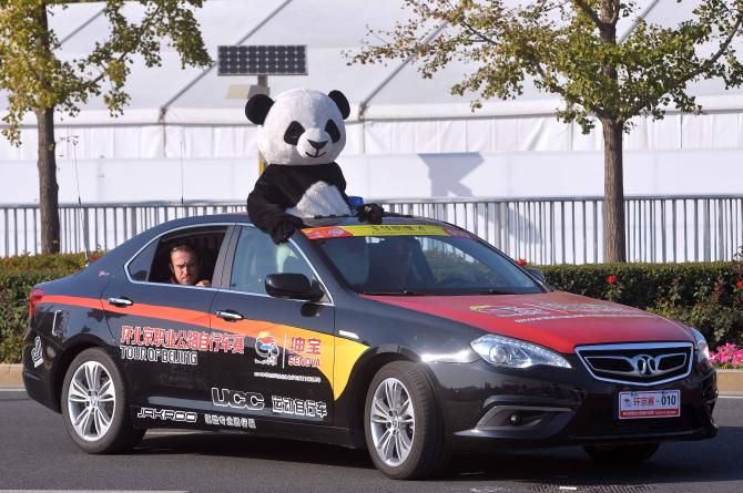 How do you get a panda in a car?