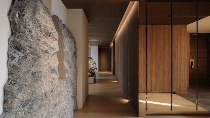 apartment interior design with a rock wall 