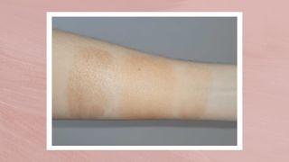 A close-up of Beauty Writer, Naomi Jamieson's arm with three swatches of bronzers mixed with Vaseline applied to the skin