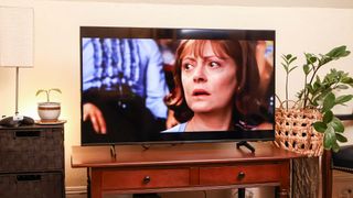 Samsung DU8000 LED TV on console in living room