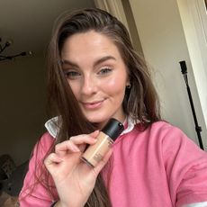 Tori Crowther holding a bottle of the new MAC Studio Fix Fluid SPF 15 Foundation