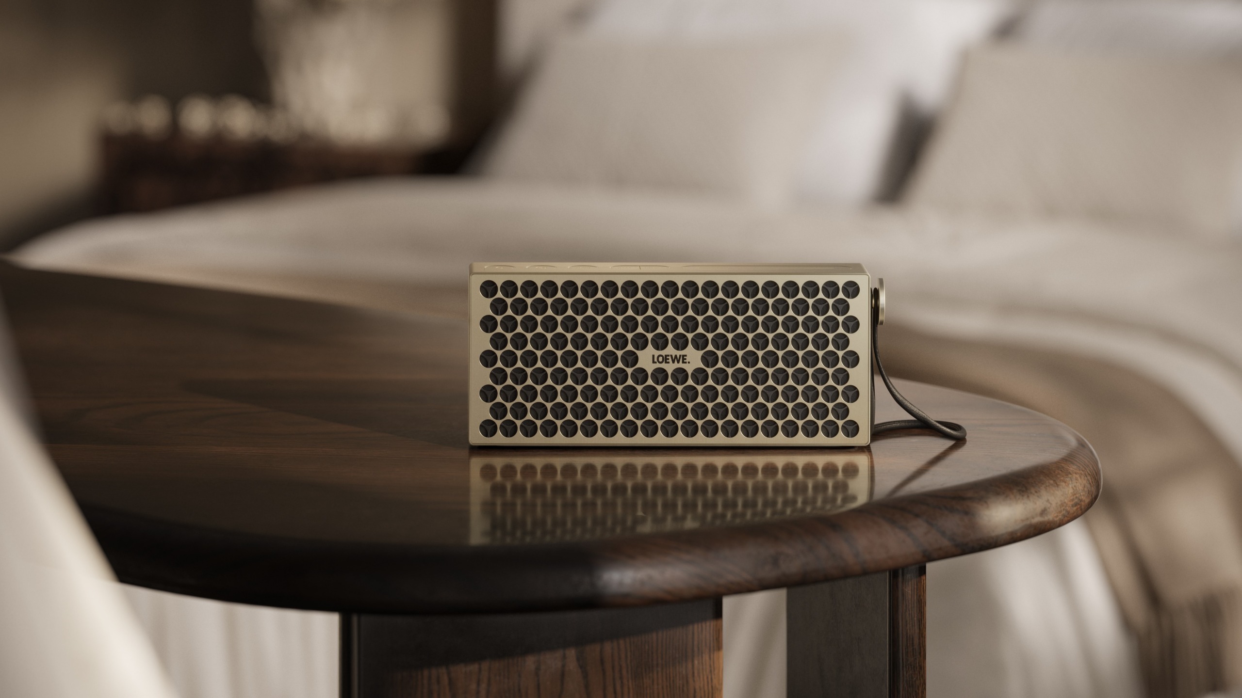 Loewe Neo Bluetooth speaker in a bougee setting