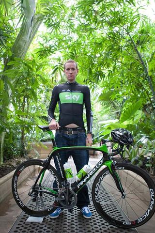 Bradley Wiggins shows off the new paint job on his Pinarello and a little midriff too