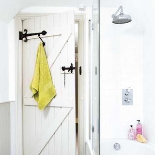 bathroom with shower and lime green towels
