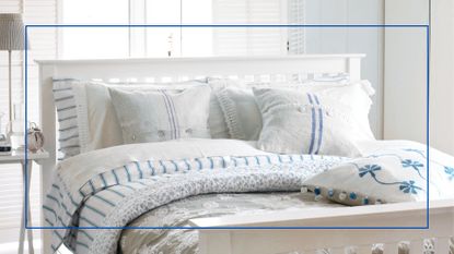 white bedroom with windows open to show show how to keep a bed cool by creating a cross-breeze