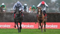 Paul Townend riding Banbridge and from James Reveley riding Il Est Francais clear the last in The Ladbrokes King George VI Chase at Kempton Park