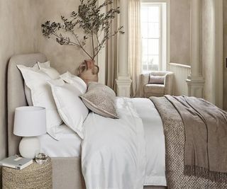 Kingham bedding collection on a bed.