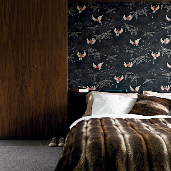 bedroom with wallpaper and wardrobe
