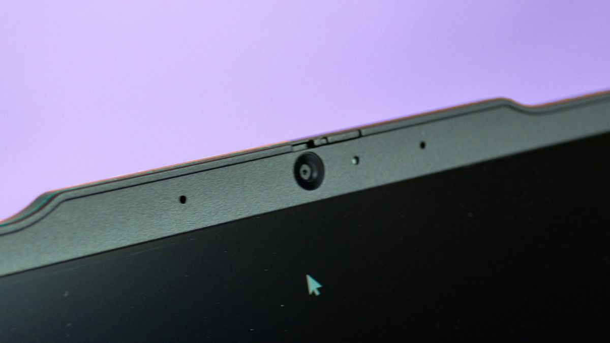 An Lenovo ThinkPad E14 Gen 5 on a purple deskmat