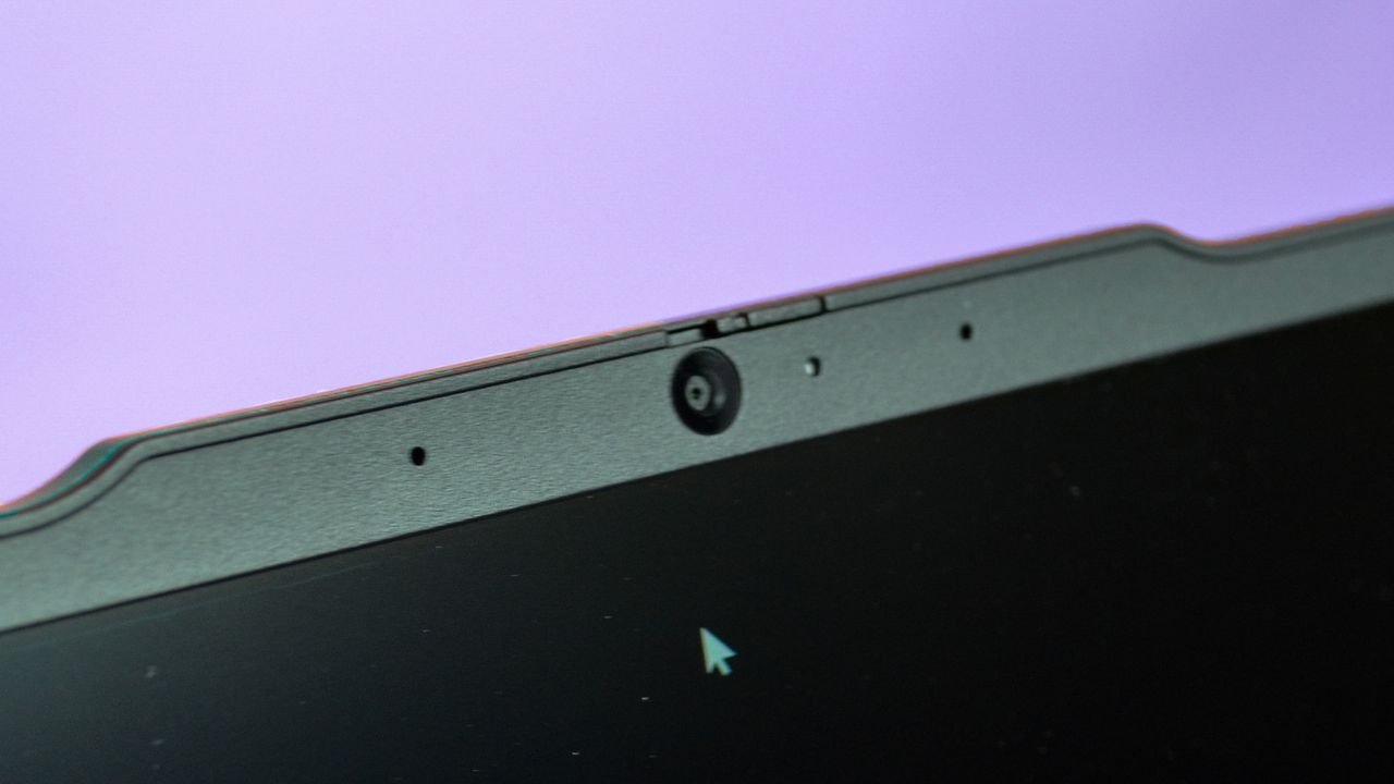 An Lenovo ThinkPad E14 Gen 5 on a purple deskmat