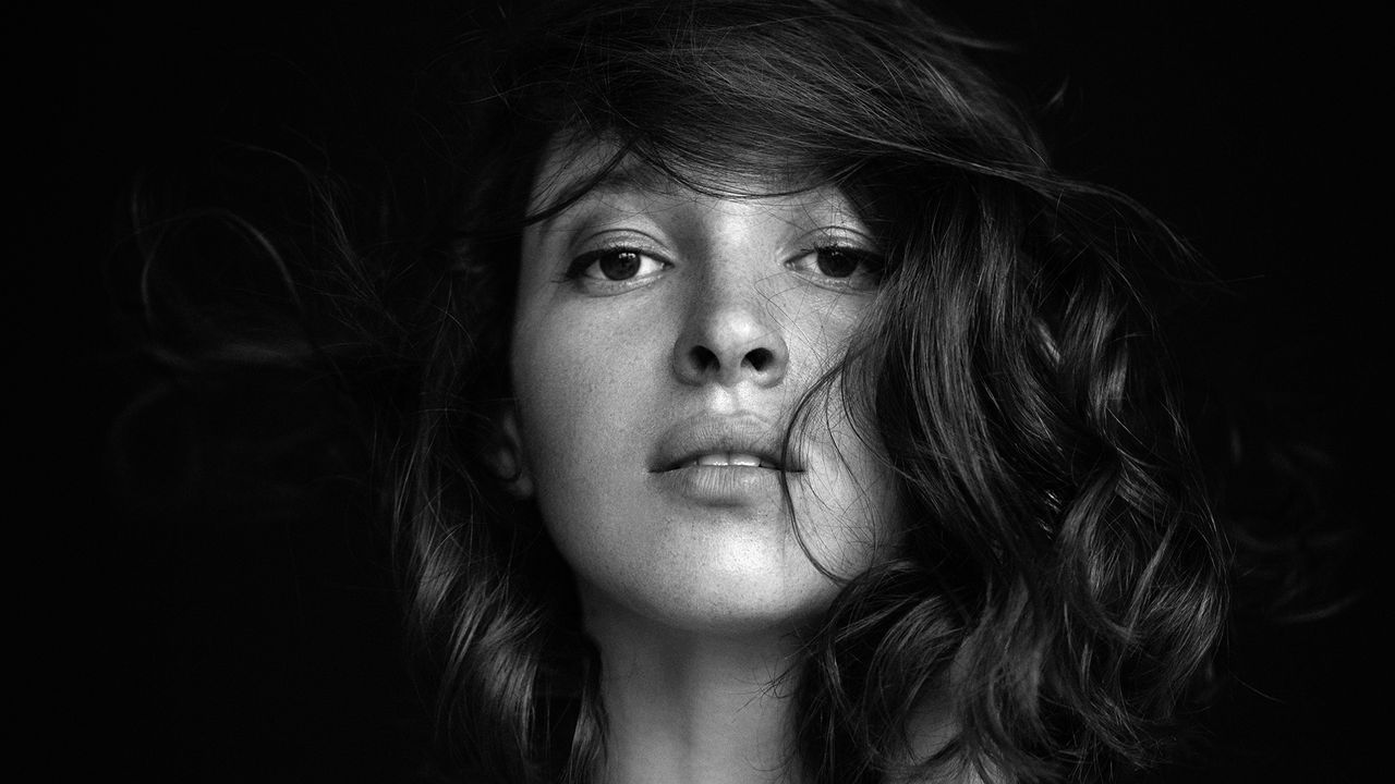 black and white image of a woman with glossy hair - apple cider vinegar for hair