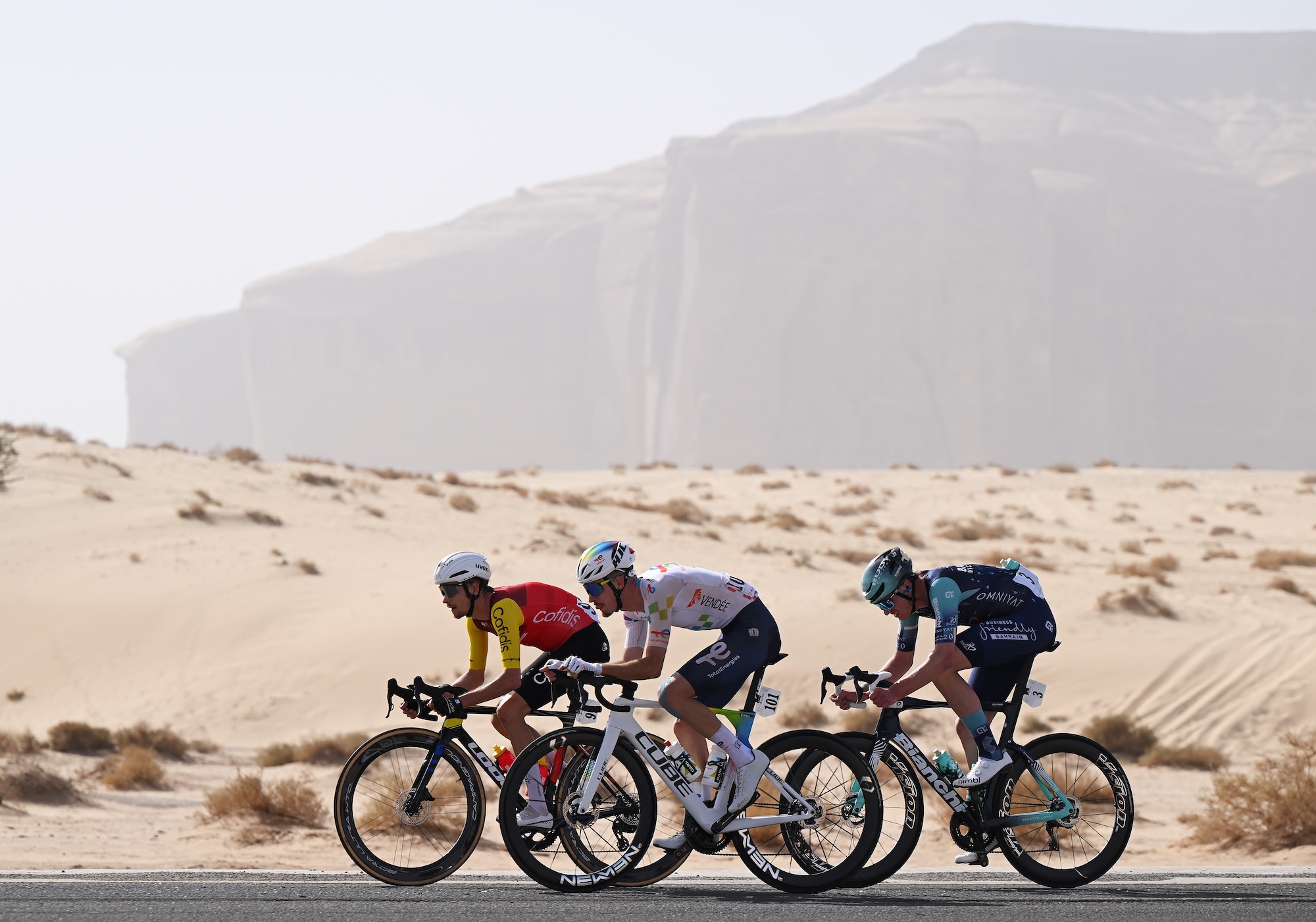 ALMANSHIYAH, SAUDI ARABIA - JANUARY 28: (L-R) Yael Joalland of France and Team Cofidis, Joris Delbove of France and Team TotalEnergies and Seth Dunwoody of Ireland and Team Bahrain Victorious compete in the breakaway during the 6th AlUla Tour 2026, Stage 2 a 152km stage from AlManshiyah Train Station to AlManshiyah Train Station on January 28, 2026 in AlManshiyah, Saudi Arabia. (Photo by Dario Belingheri/Getty Images)