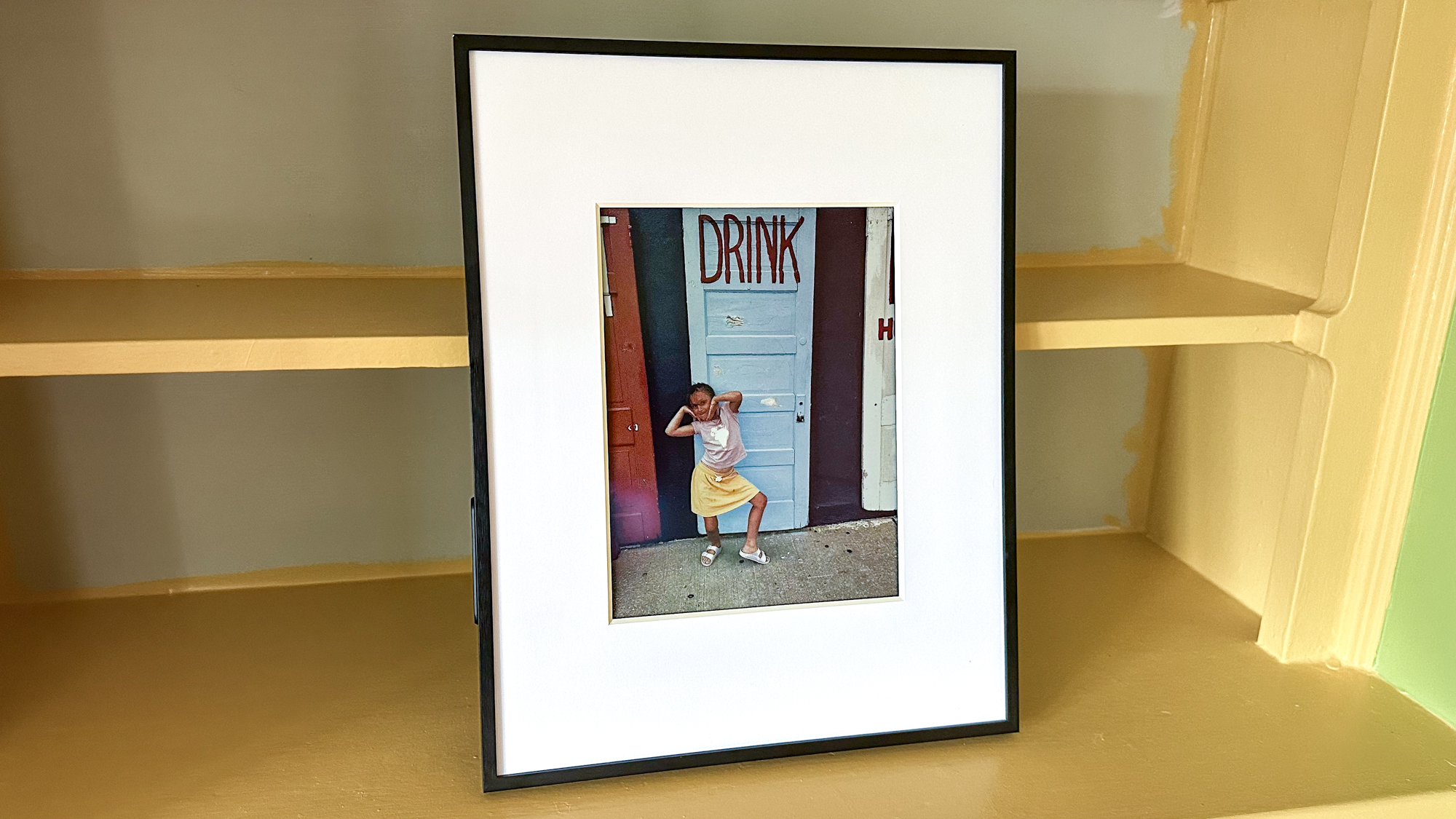Aluratek ePaper 13.3 inch Wifi Digital Photo Frame on a shelf