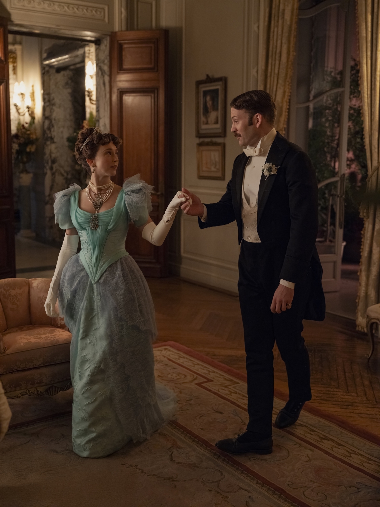 taissa farmiga and ben lamb as gladys and hector holding hands in the gilded age season 3 finale