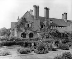 The Dutch Garden at Orchards, Surrey, designed by Sir Edwin Lutyens in 1897 with planting laid out by Gertrude Jekyll, was described as their ‘first masterpiece’. This picture was first published in 1908 in Country Life. ©Country Life