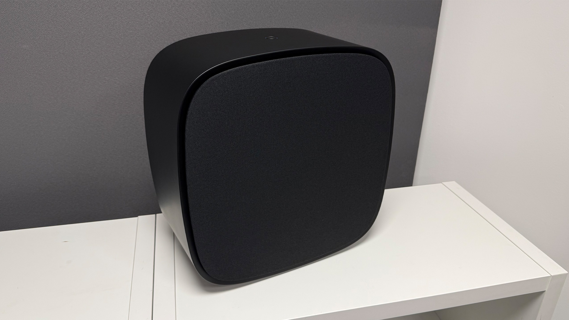 LG Sound Suite system soundbar system subwoofer on white shelving unit