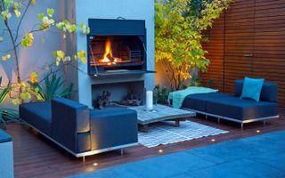 how to make a garden feel modern: outdoor fire