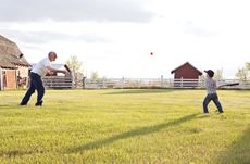 Learning how to his the baseball with Grandpa.Rural Alberta in the Spring