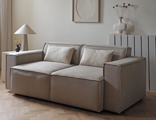 a minimalist beige sofa