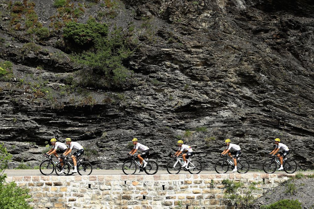 Chris Froome surrounded by teammates during stage 18 of the Tour de France
