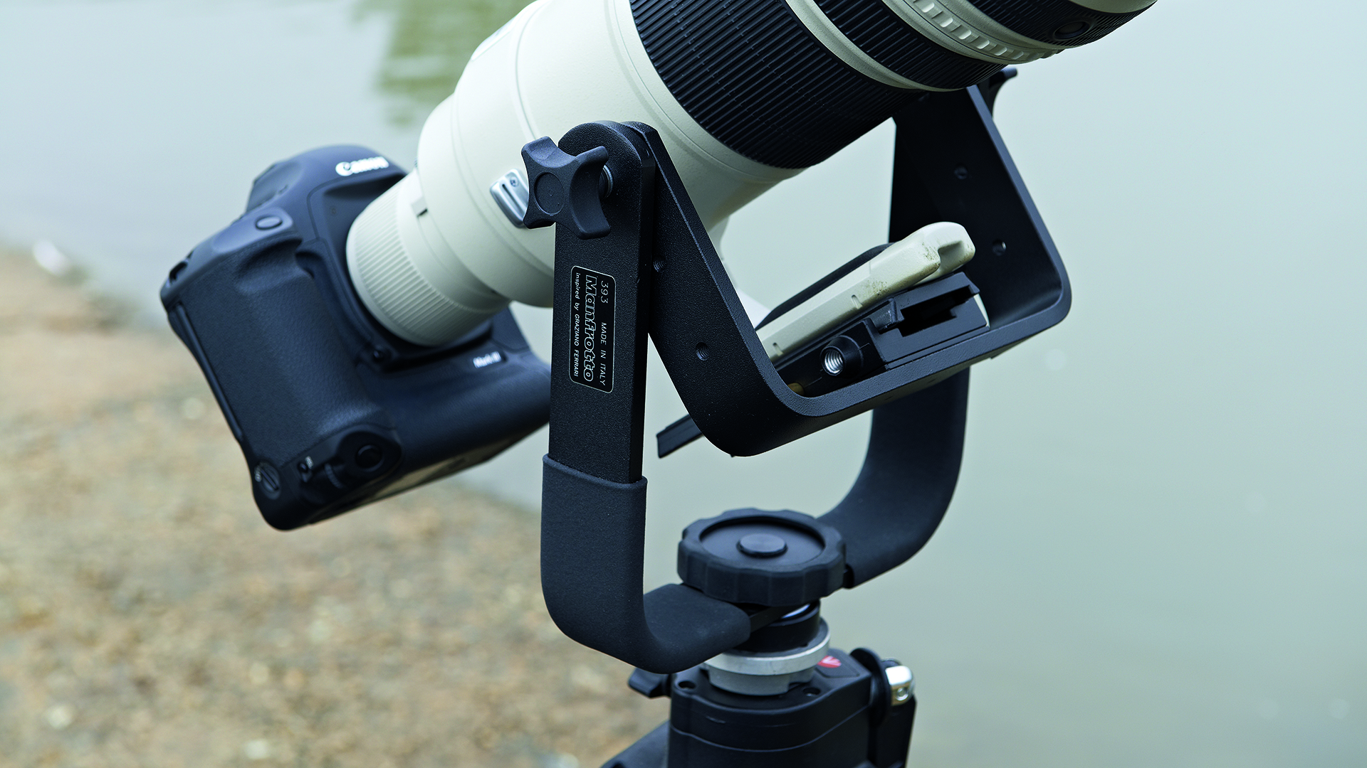 Closeup of Manfrotto 393 Long Lens Monopod Bracket with Canon camera and lens attached