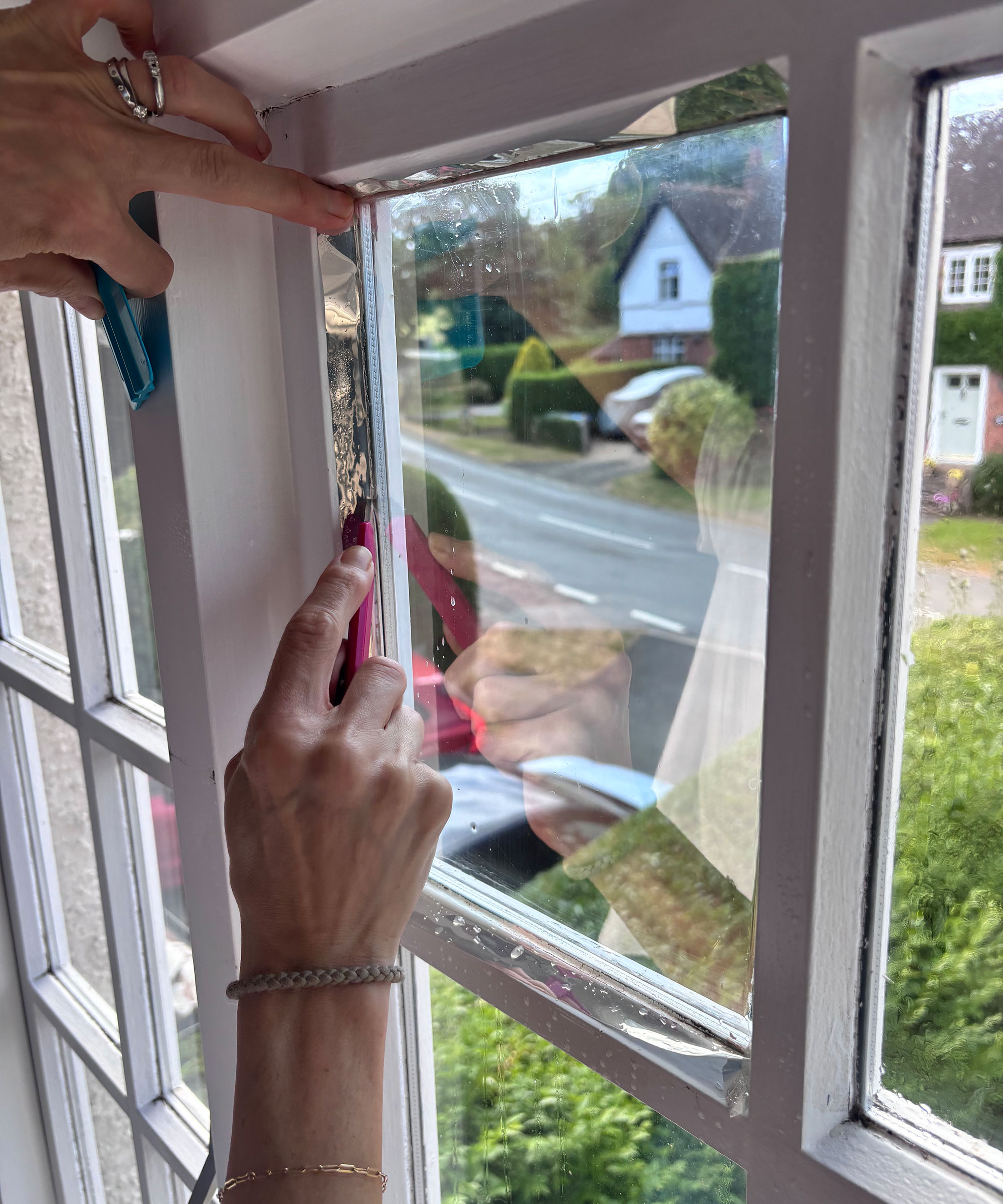 using a craft knife to trim solar control window film