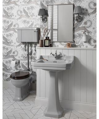 Grey bathroom suite with printed wallpaper by Retrobad