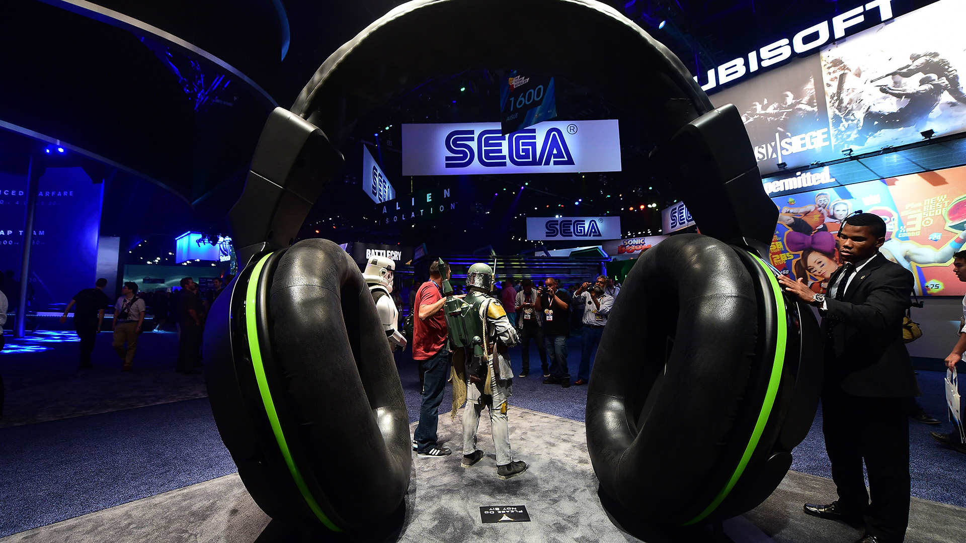 A Turtle Beach headset display attracts a man's attention on day two at the annual E3 video game extravaganza in Los Angeles, California on June 11, 2014