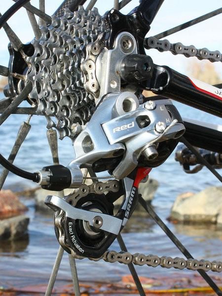 A SRAM Red rear derailleur moves the chain back and forth across the cogs.
