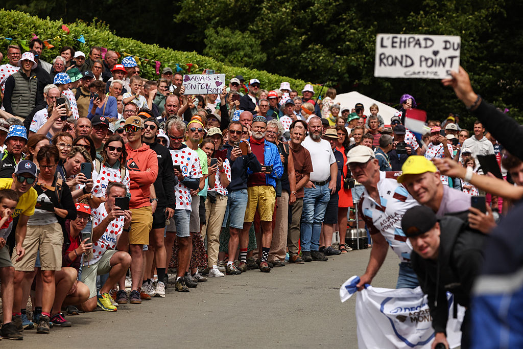 Spectators line the race route on the ascent of Mont Noir during the 1st stage of the 112th edition of the Tour de France cycling race, 184.9 km starting and finishing in Lille Metropole, northern France, on July 5, 2025. (Photo by Anne-Christine POUJOULAT / AFP)