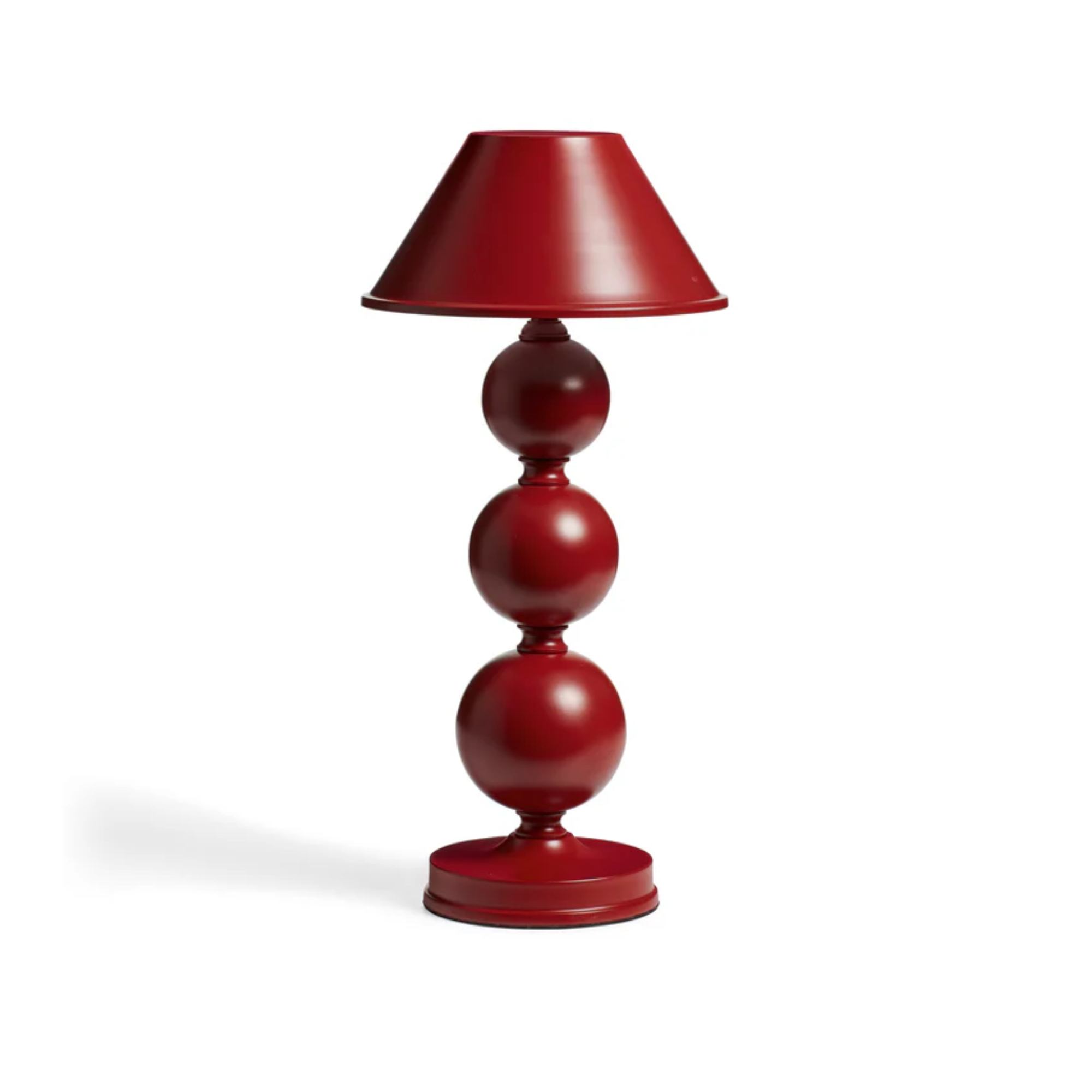 a red rechargeable lamp with a spherical shaped base and a solid shade