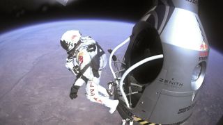 a person in a high-altitude suit beginning his fall to the ground from a capsule. the earth is visible below and the black of space
