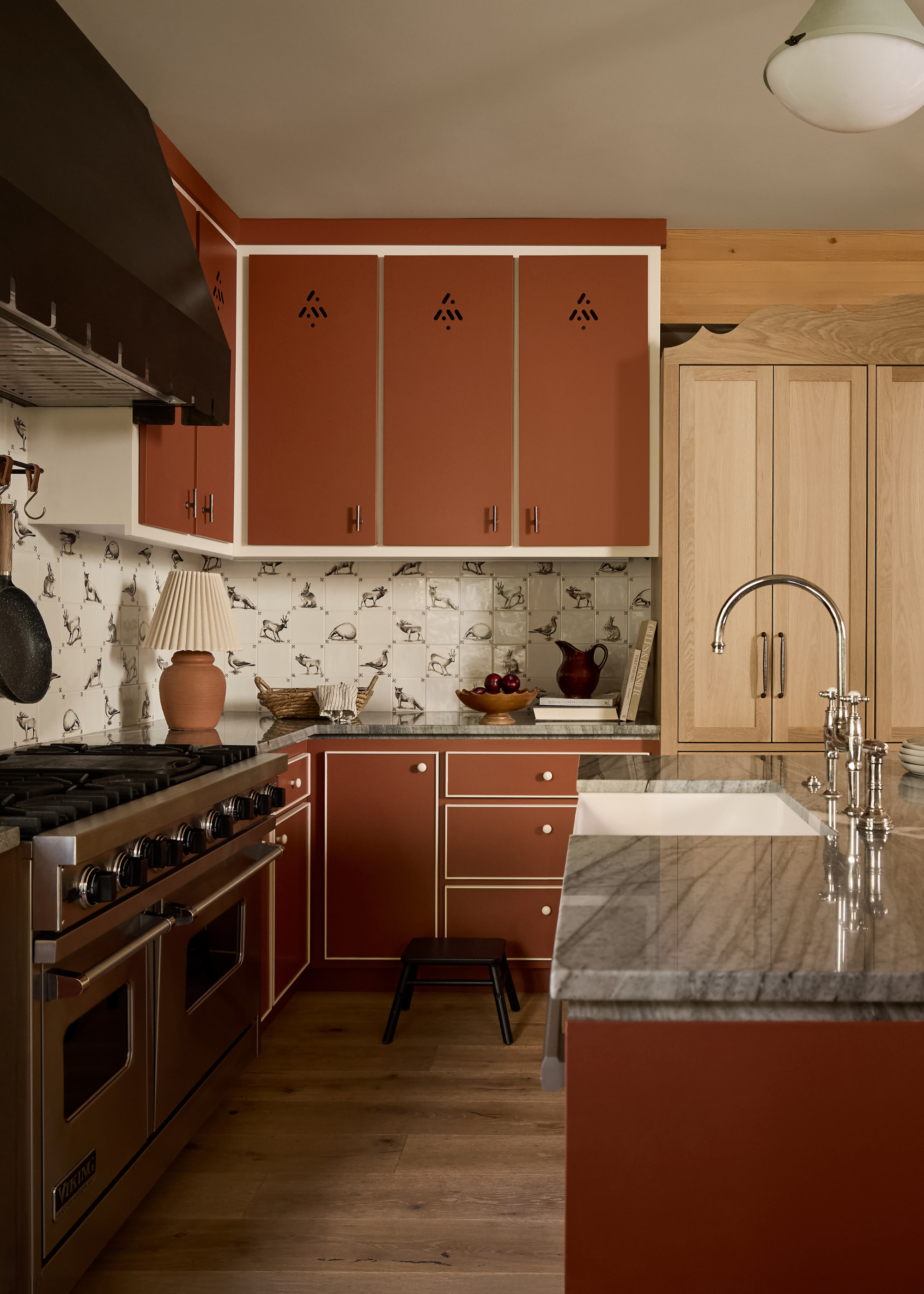 A terracotta kitchen with an offset white outline