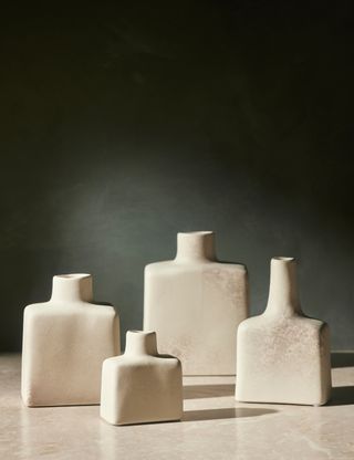 four ceramic display bottles