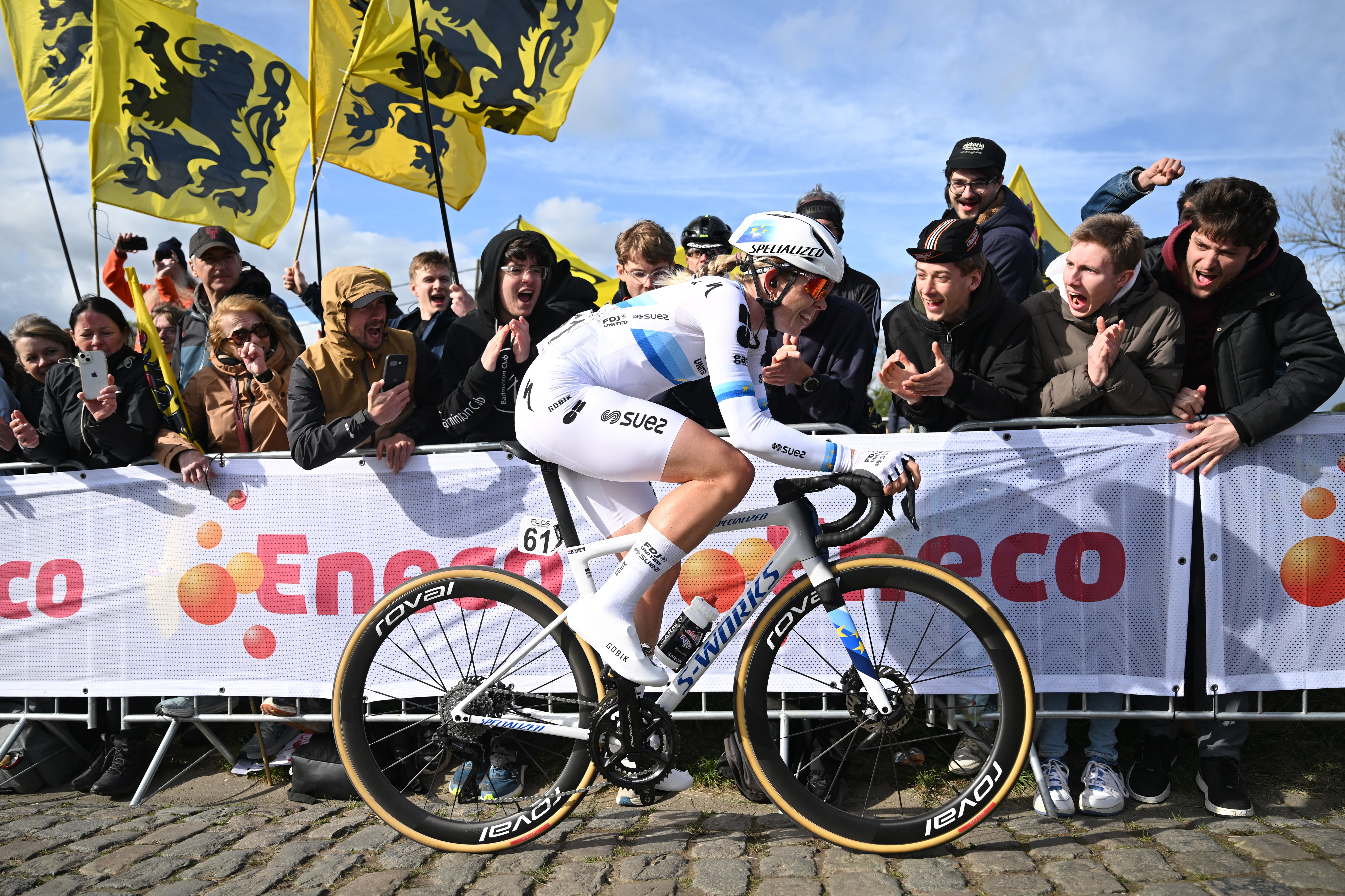 Demi Vollering of Netherlands and Team FDJ United - SUEZ competes passing through the Paterberg cobblestones sector while fans cheer during the 23rd Tour of Flanders 2026