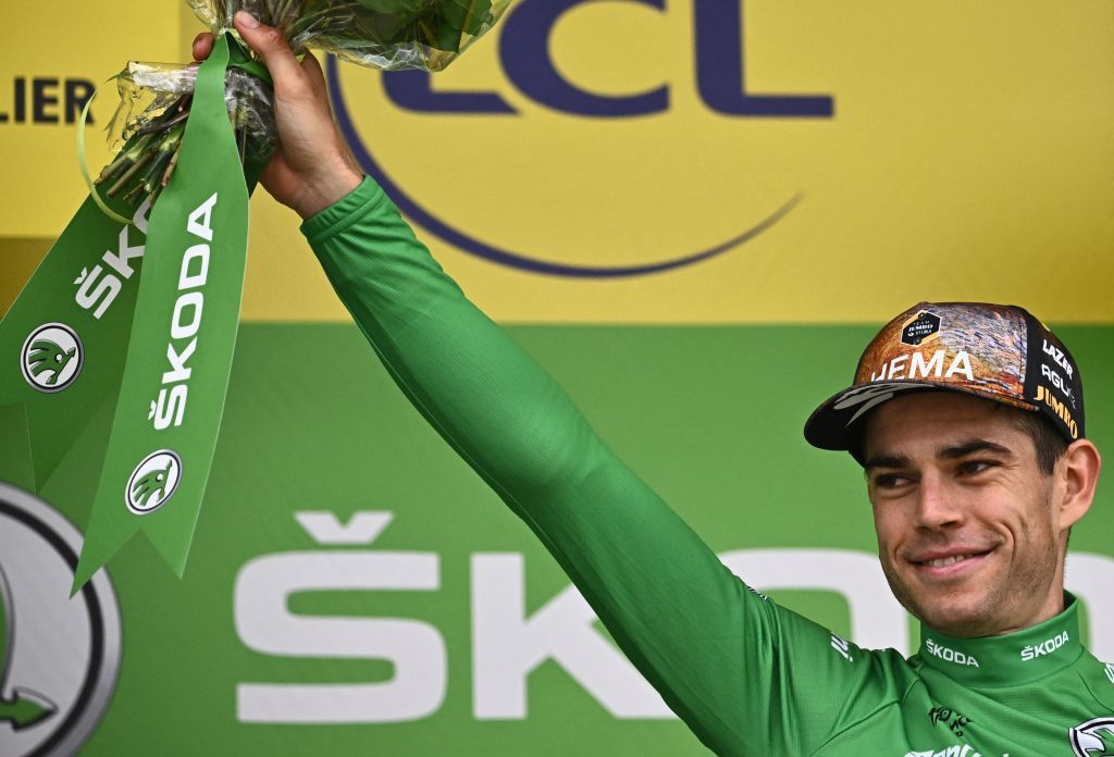JumboVisma teams Belgian rider Wout Van Aert celebrates on the podium with the sprinters green jersey after the 11th stage of the 109th edition of the Tour de France cycling race 1517 km between Albertville and Col du Granon Serre Chevalier in the French Alps on July 13 2022 Photo by AnneChristine POUJOULAT AFP Photo by ANNECHRISTINE POUJOULATAFP via Getty Images