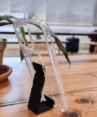 CLCKR Clear Stand Case with grip on a table