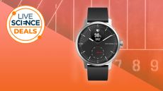 The Withings Scanwatch Hybrid smartwatch on an orange background.