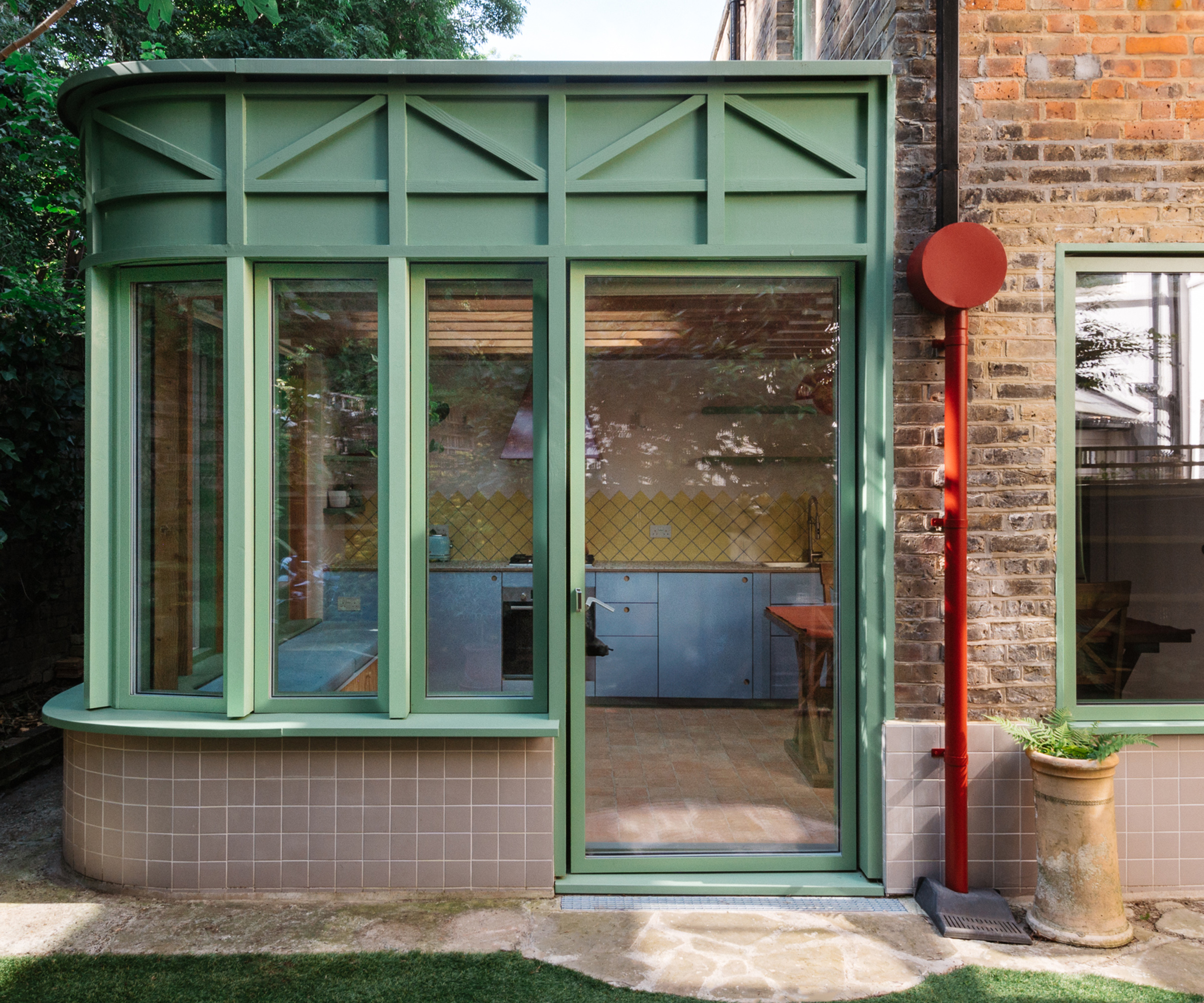 a curved side extension with green detailing 