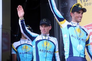 Lance Armstrong follows Contador on stage after the team won the TTT.