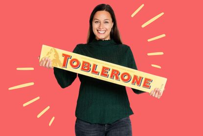 A woman holding a 4.5kg jumbo Toblerone gift bar