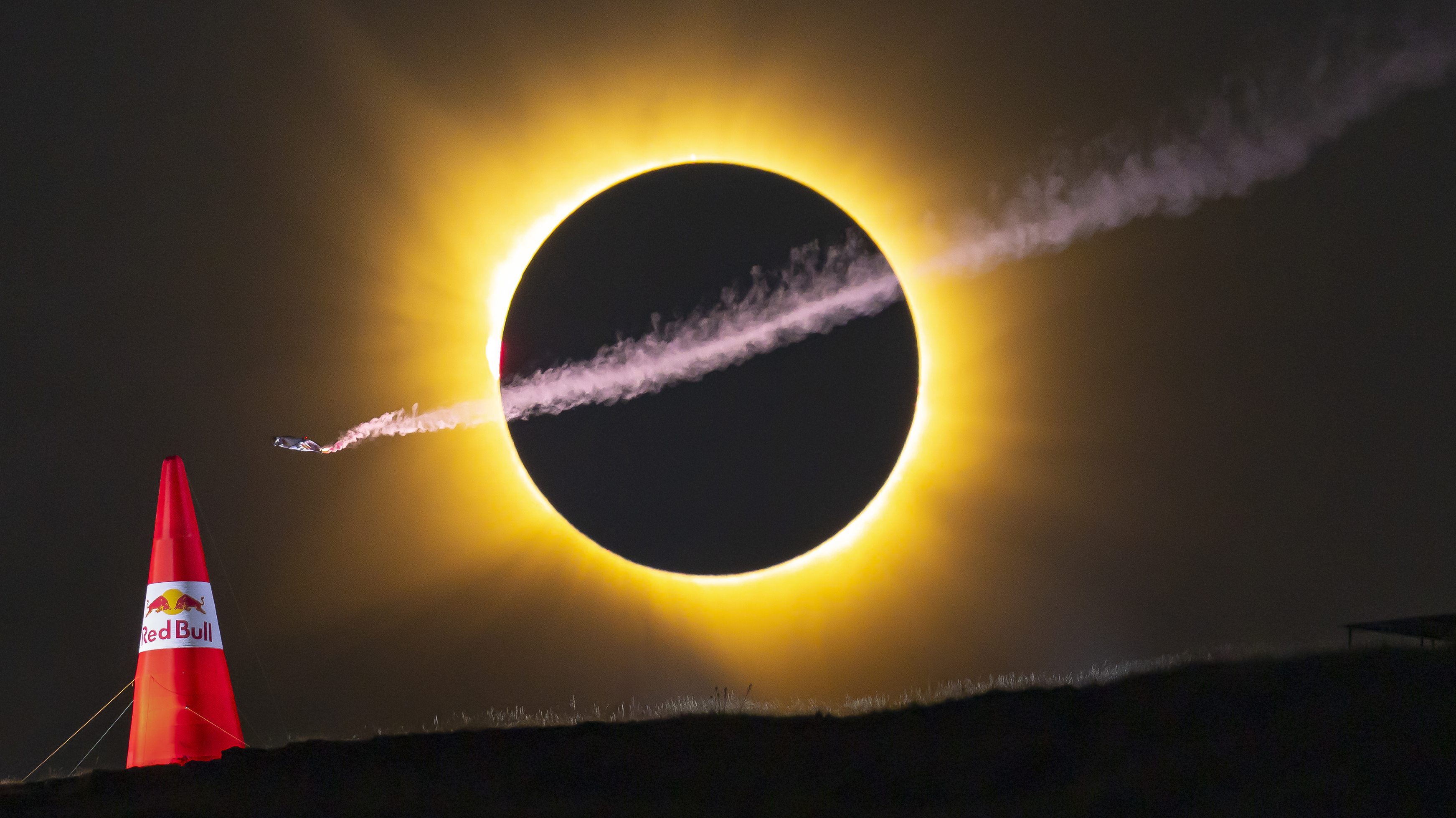 Mike Brewer wing-suits past the total eclipse in Alarilla, Spain on August 12, 2026. // Noah Wetzel / Red Bull Content Pool // SI202608130002 // Usage for editorial use only //