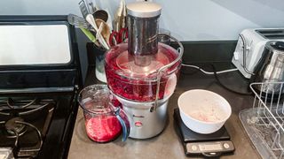 Breville Juice Fountain Compact in use on kitchen counter