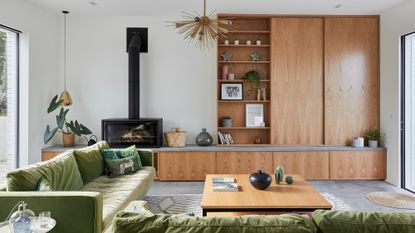 living room with green sofa and coffee table